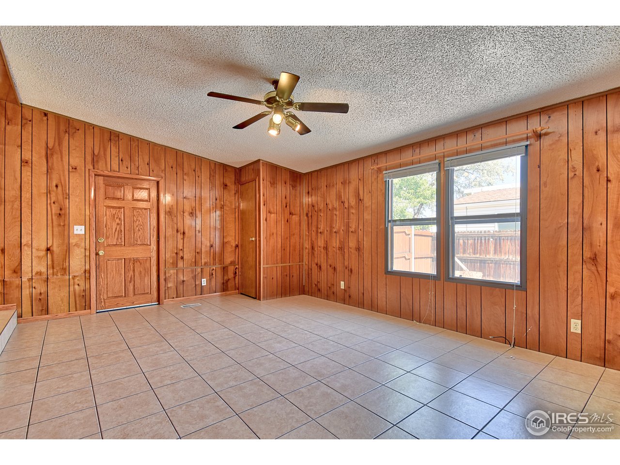 5510 Vallejo Street Denver, CO 80221 - Photo 4 of 22 a view of an empty room with a window