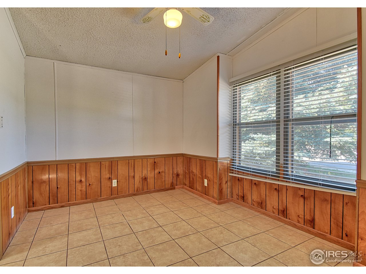 5510 Vallejo Street Denver, CO 80221 - Photo 7 of 22 a view of an empty room with a window