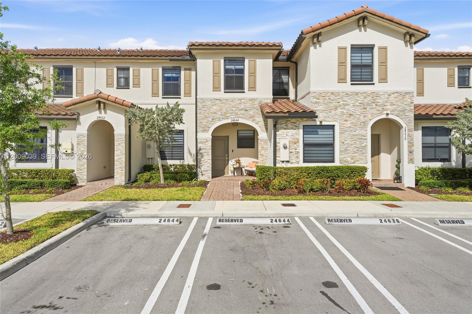 24644 Southwest 118 Court Homestead, FL 33032 - Photo 1 of 33 a front view of a house with a yard and a garage