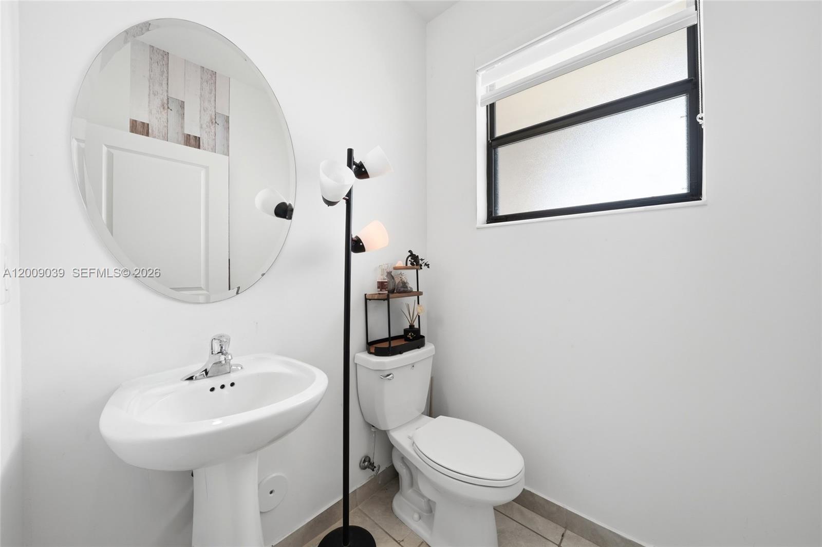 24644 Southwest 118 Court Homestead, FL 33032 - Photo 17 of 33 a bathroom with a sink toilet and mirror