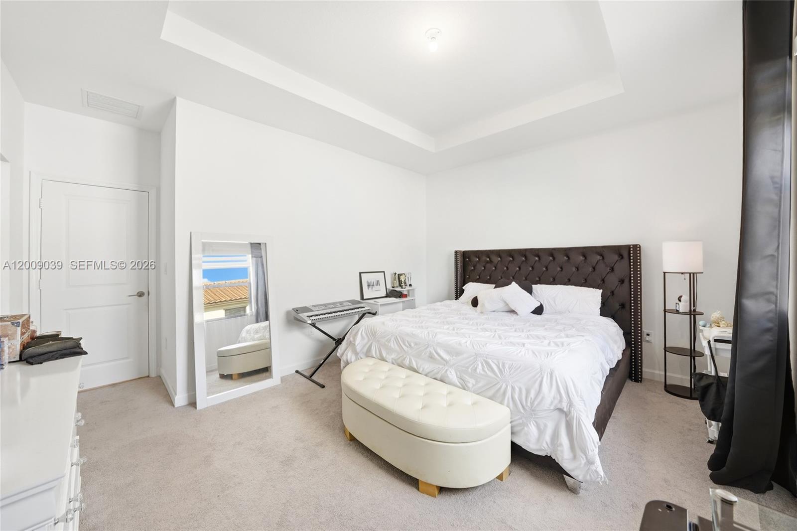 24644 Southwest 118 Court Homestead, FL 33032 - Photo 20 of 33 a bedroom with a bed and a lamp
