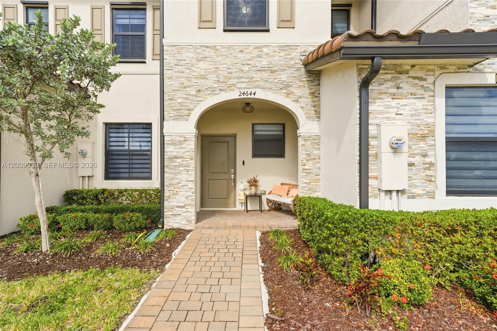 24644 Southwest 118 Court Homestead, FL 33032 - Photo 2 of 33 a front view of a house with garden
