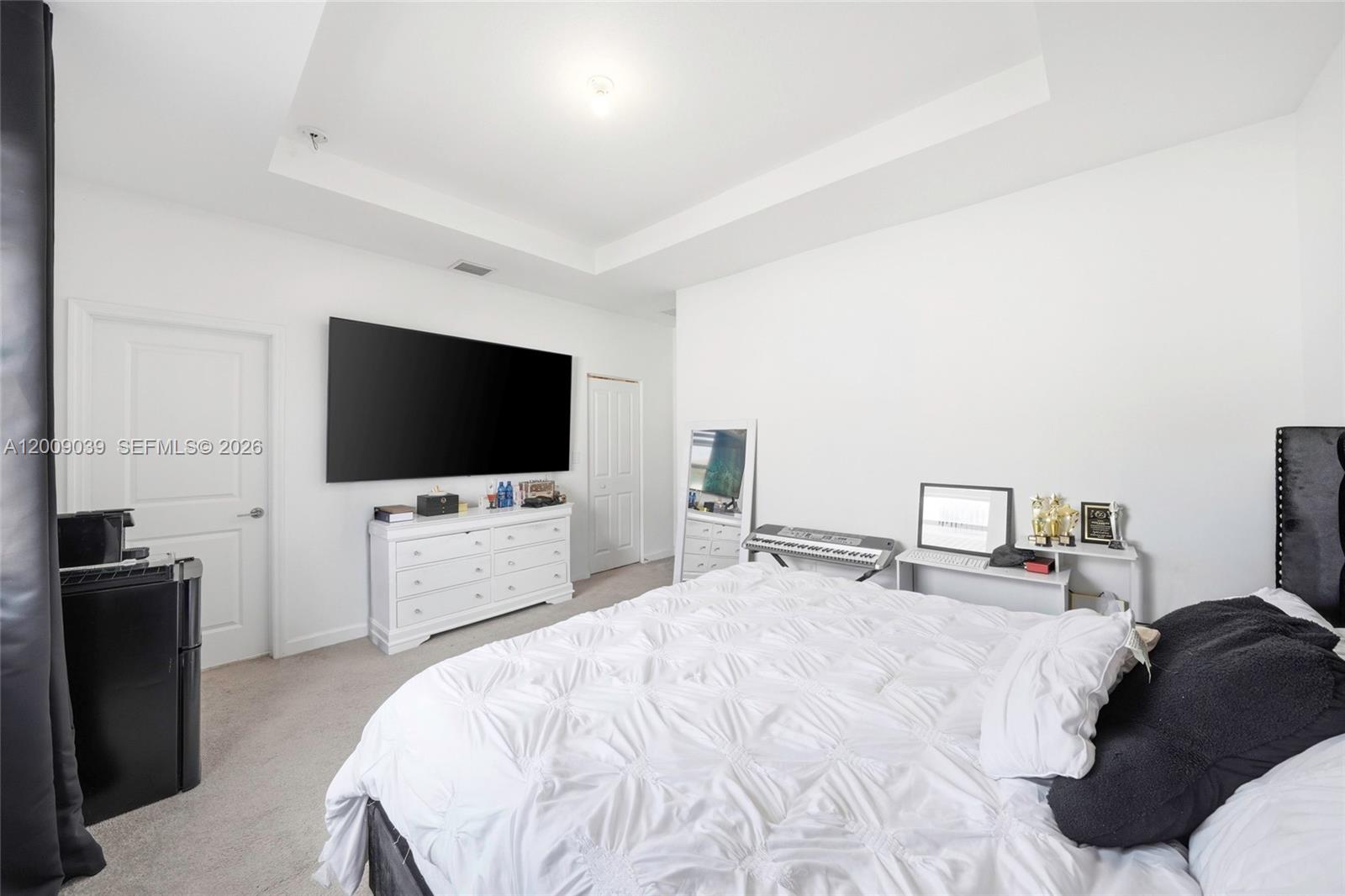 24644 Southwest 118 Court Homestead, FL 33032 - Photo 21 of 33 a bedroom with a bed and a flat screen tv