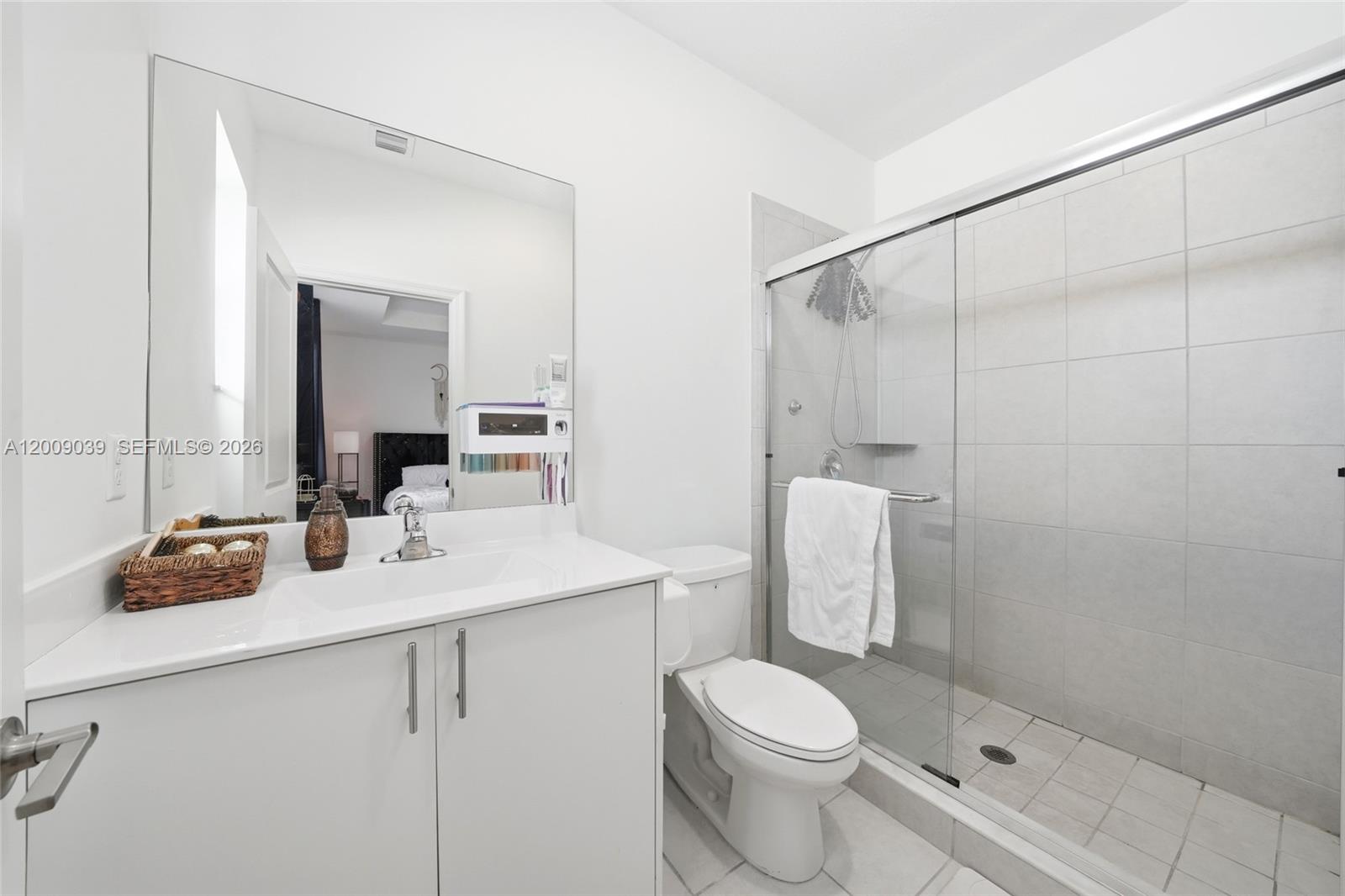 24644 Southwest 118 Court Homestead, FL 33032 - Photo 22 of 33 a bathroom with a sink a toilet and shower
