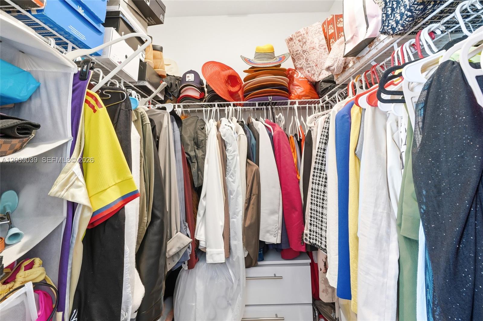 24644 Southwest 118 Court Homestead, FL 33032 - Photo 23 of 33 a view of walk in closet with clothes and shoes
