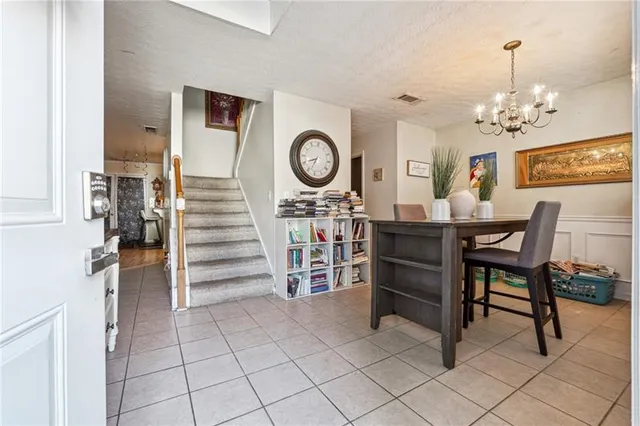a view of a dining room kitchen and hallway