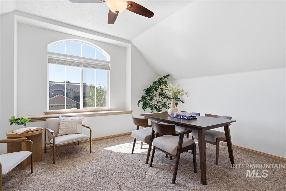 1183 North Buffalo Way Middleton, ID 83644 - Photo 28 of 47 Vaulted ceiling space featuring an arched window, textured carpeting, and a ceiling fan with integrated lighting
