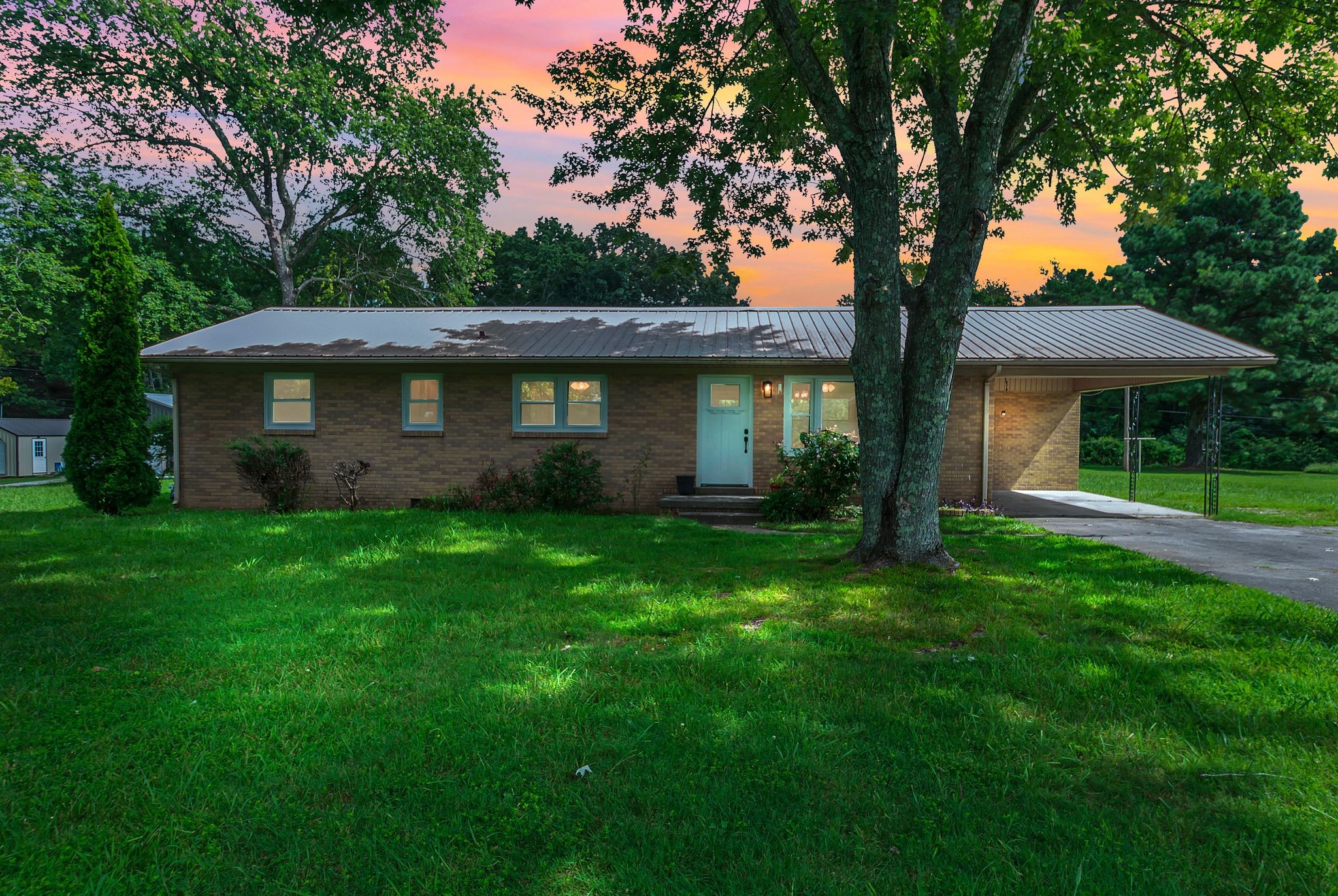 107 Horseshoe Bend Road Leoma, TN 38468 - Photo 1 of 35 a front view of a house with a garden