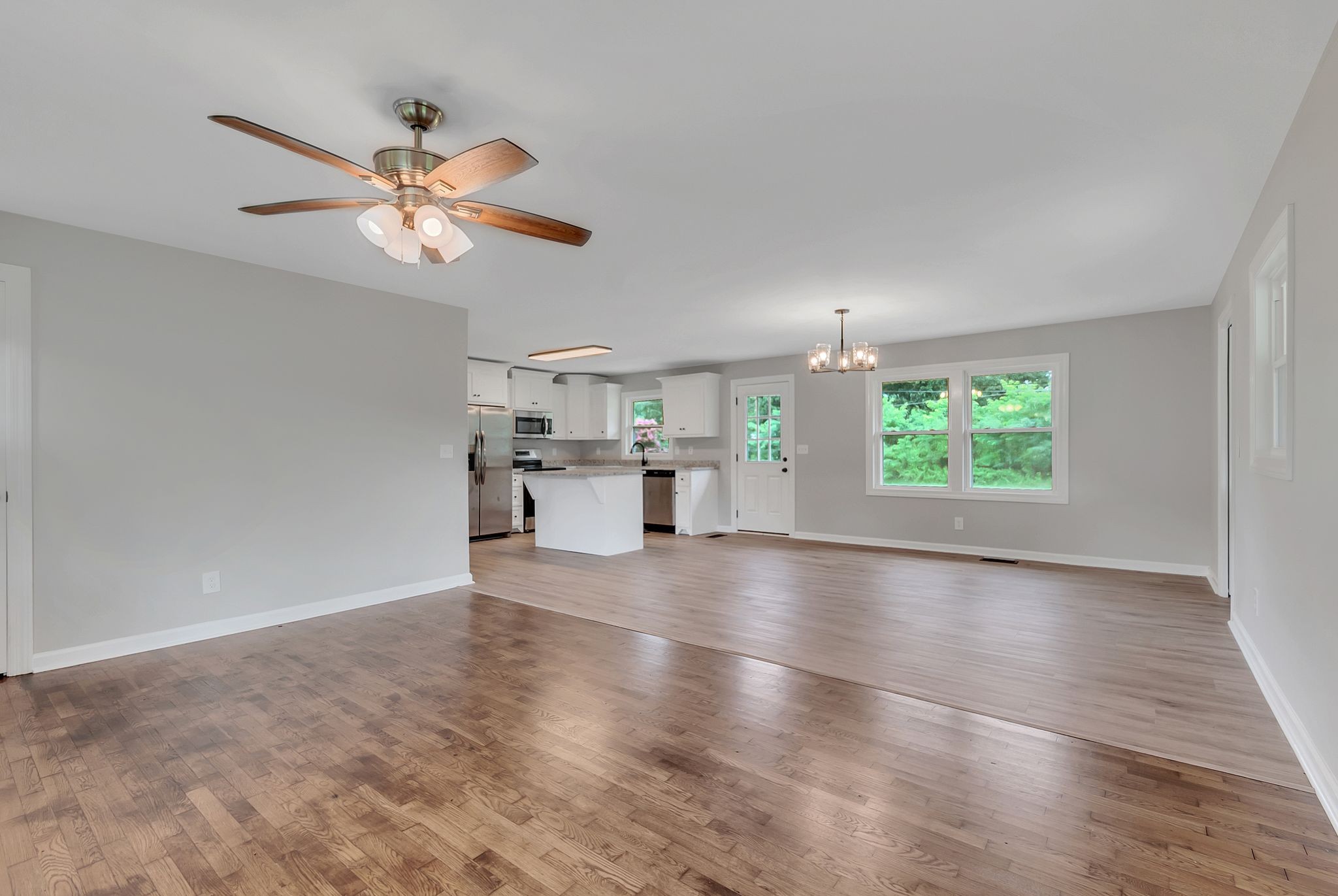 107 Horseshoe Bend Road Leoma, TN 38468 - Photo 11 of 35 an empty room with windows and ceiling fan