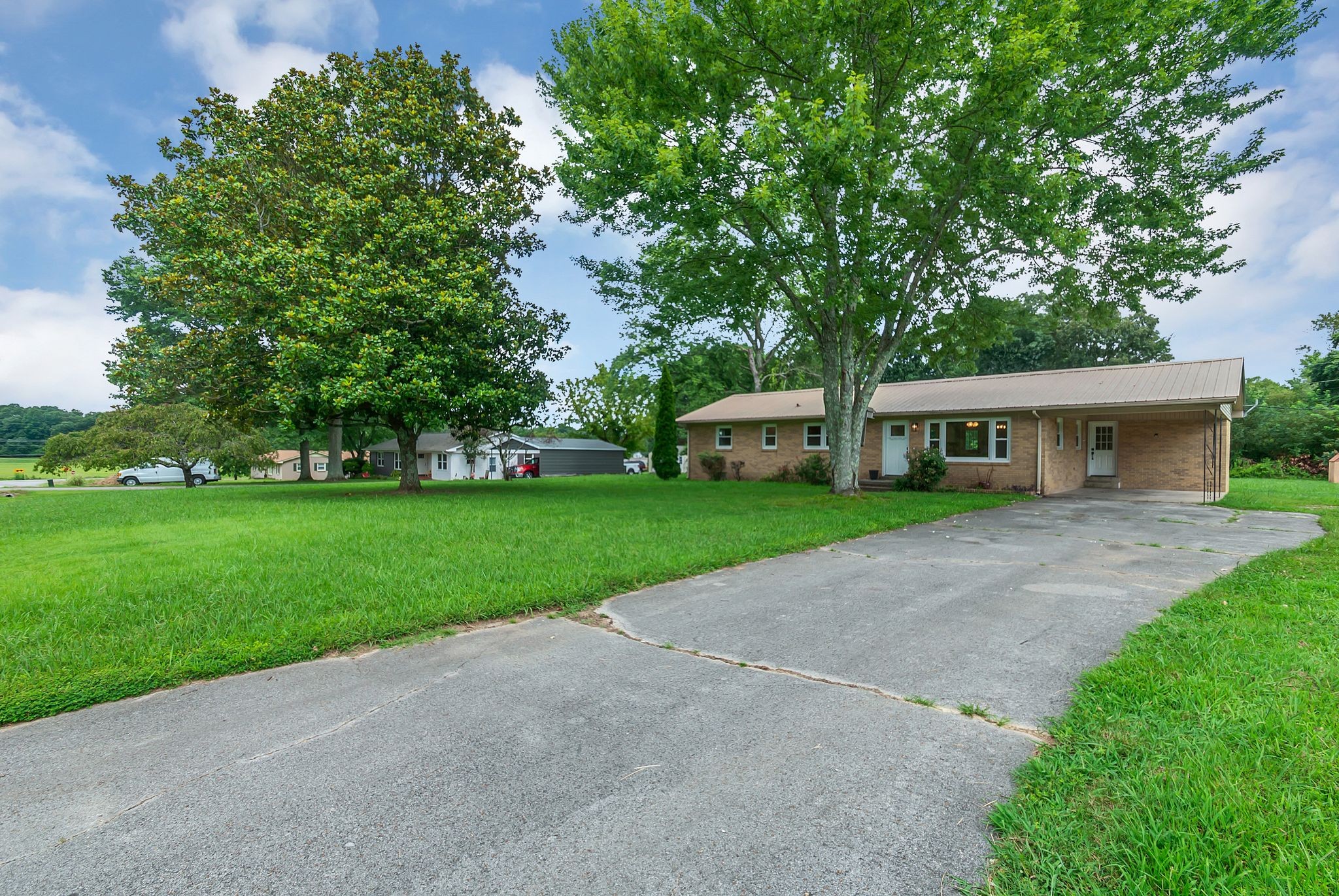 107 Horseshoe Bend Road Leoma, TN 38468 - Photo 2 of 35 a front view of house with yard and green space