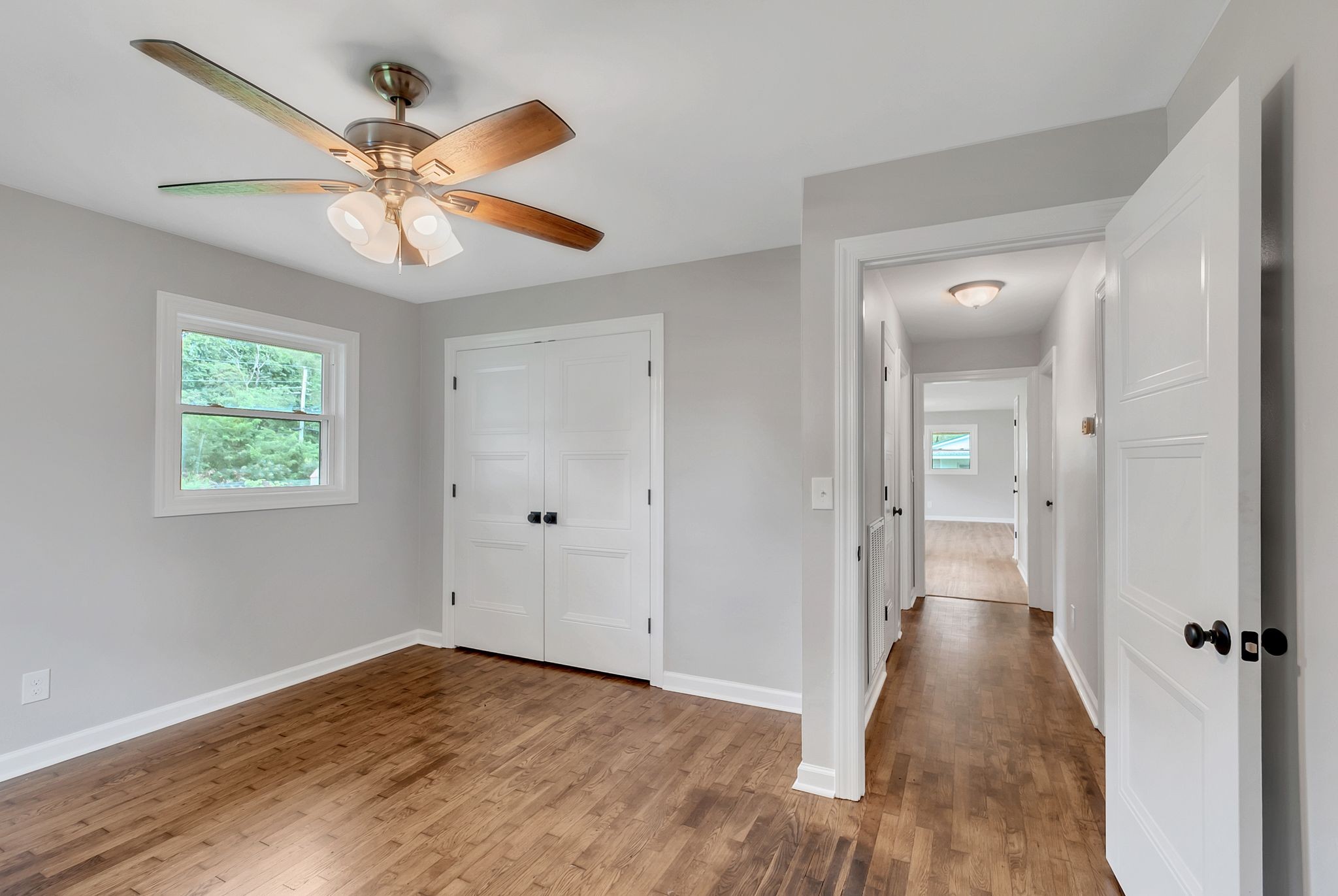 107 Horseshoe Bend Road Leoma, TN 38468 - Photo 24 of 35 wooden floor in an empty room with a window