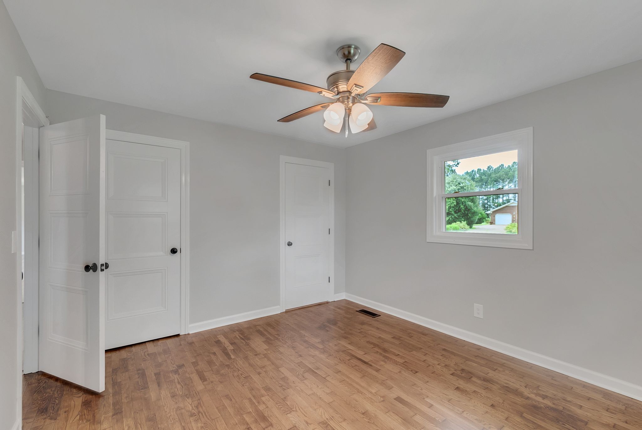 107 Horseshoe Bend Road Leoma, TN 38468 - Photo 28 of 35 wooden floor in an empty room with a window