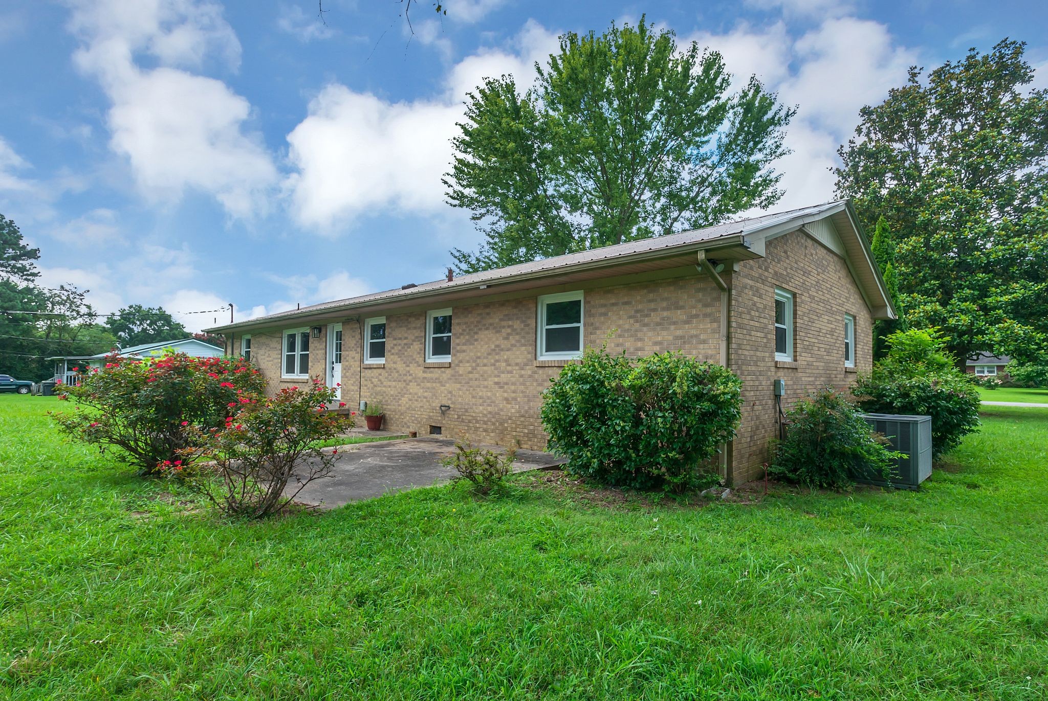 107 Horseshoe Bend Road Leoma, TN 38468 - Photo 33 of 35 a front view of house with a garden