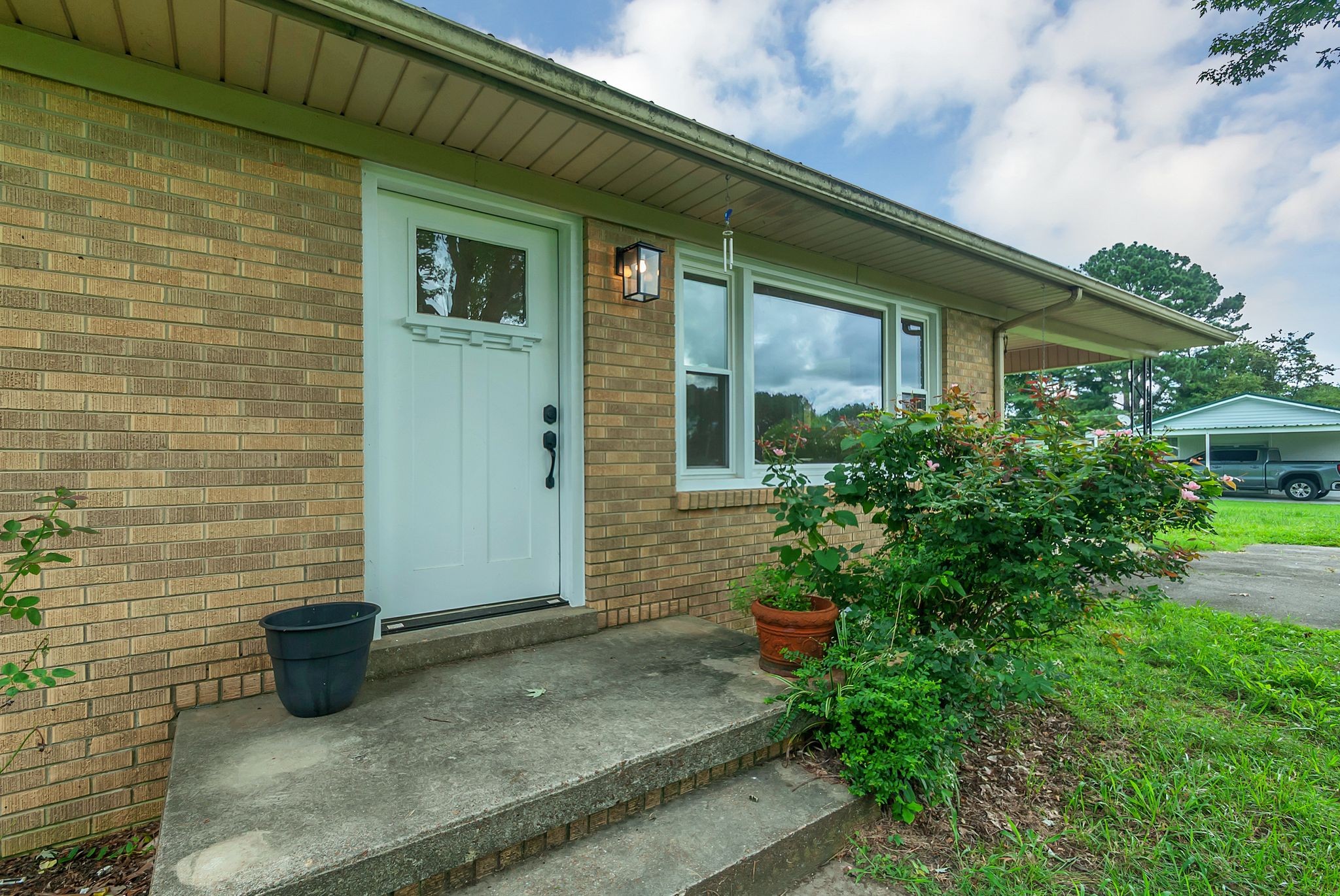 107 Horseshoe Bend Road Leoma, TN 38468 - Photo 7 of 35 a view of a brick house with a large windows