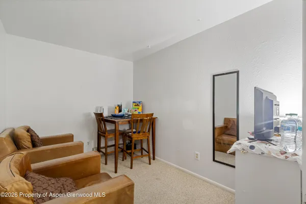 a view of hallway with closet and window