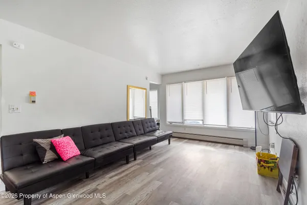 a living room with furniture and a window