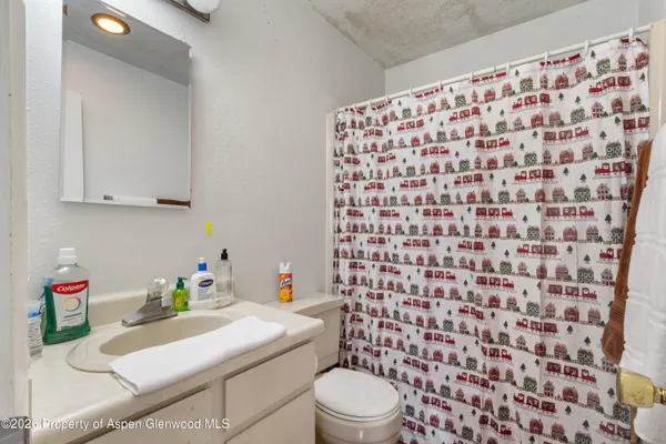 a view of a bedroom with window and furniture