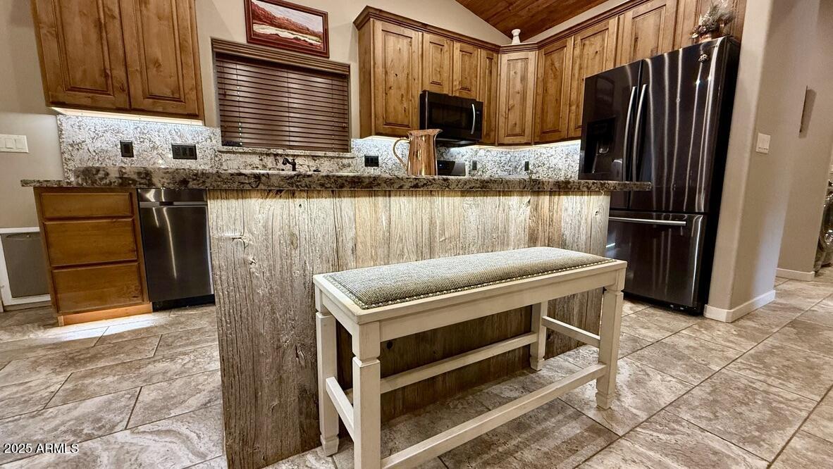 913 South Coronado Way Payson, AZ 85541 - Photo 12 of 52 a kitchen with a refrigerator and a stove