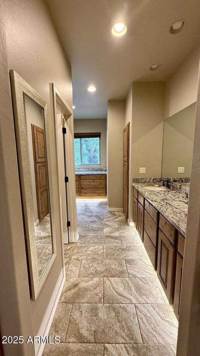 913 South Coronado Way Payson, AZ 85541 - Photo 18 of 52 a bathroom with a granite countertop sink a mirror and a shower