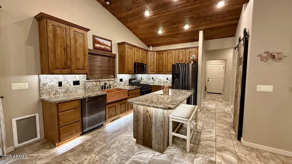 913 South Coronado Way Payson, AZ 85541 - Photo 25 of 52 a kitchen with stainless steel appliances granite countertop a sink stove and refrigerator