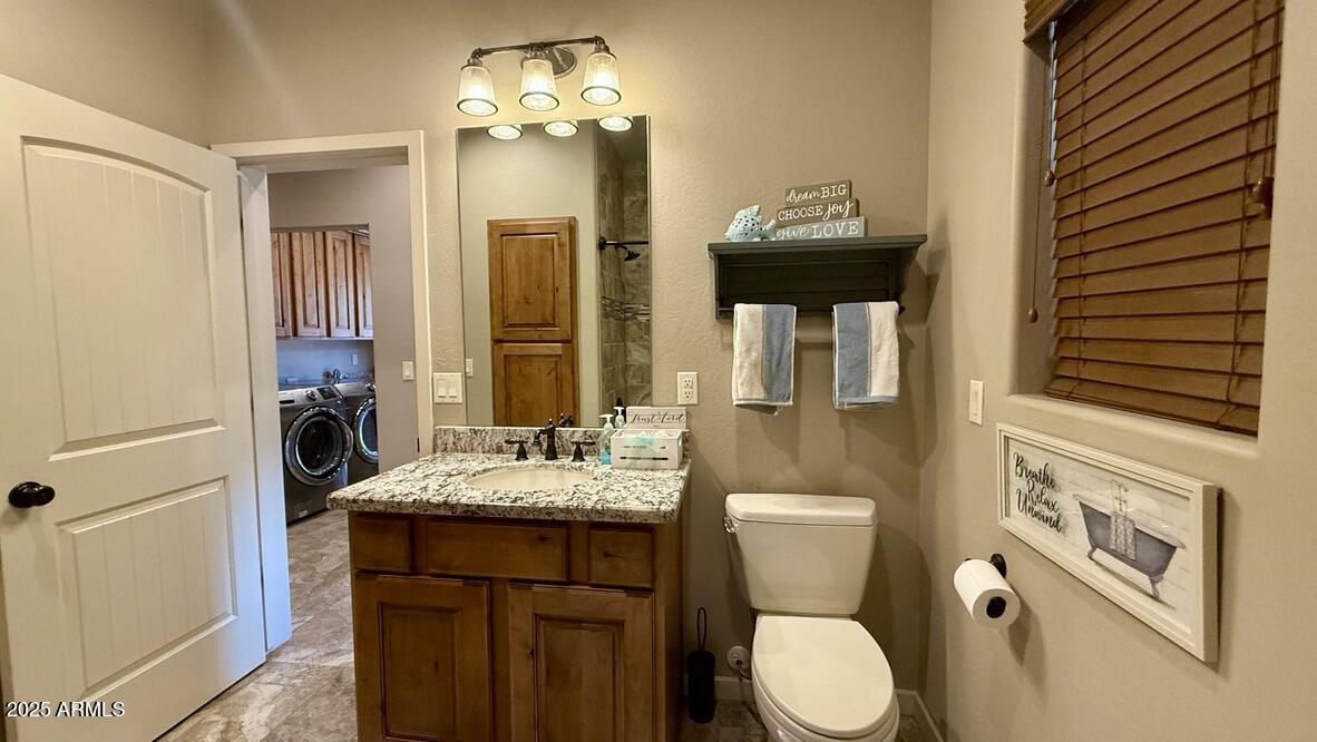 913 South Coronado Way Payson, AZ 85541 - Photo 31 of 52 a bathroom with a granite countertop sink toilet and shower