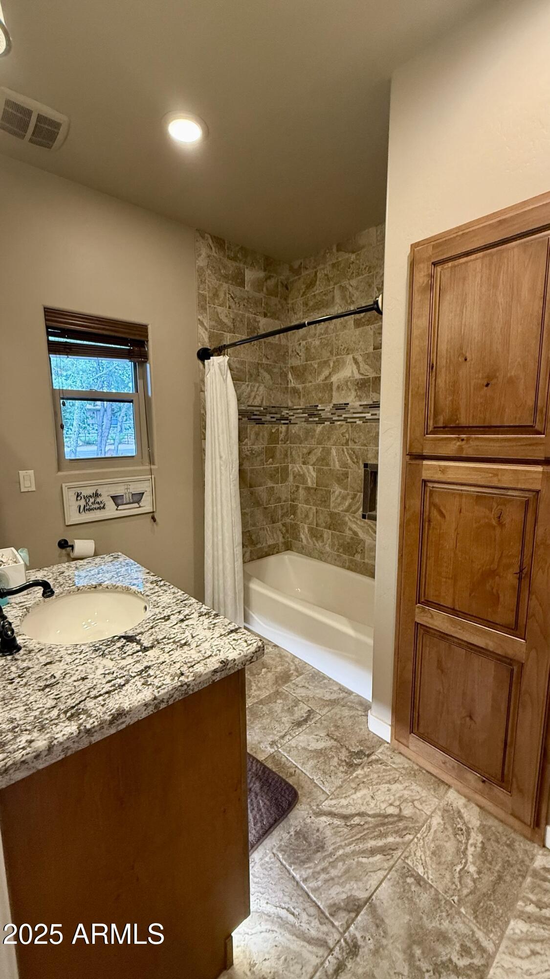 913 South Coronado Way Payson, AZ 85541 - Photo 32 of 52 a bathroom with a granite countertop sink a mirror and shower