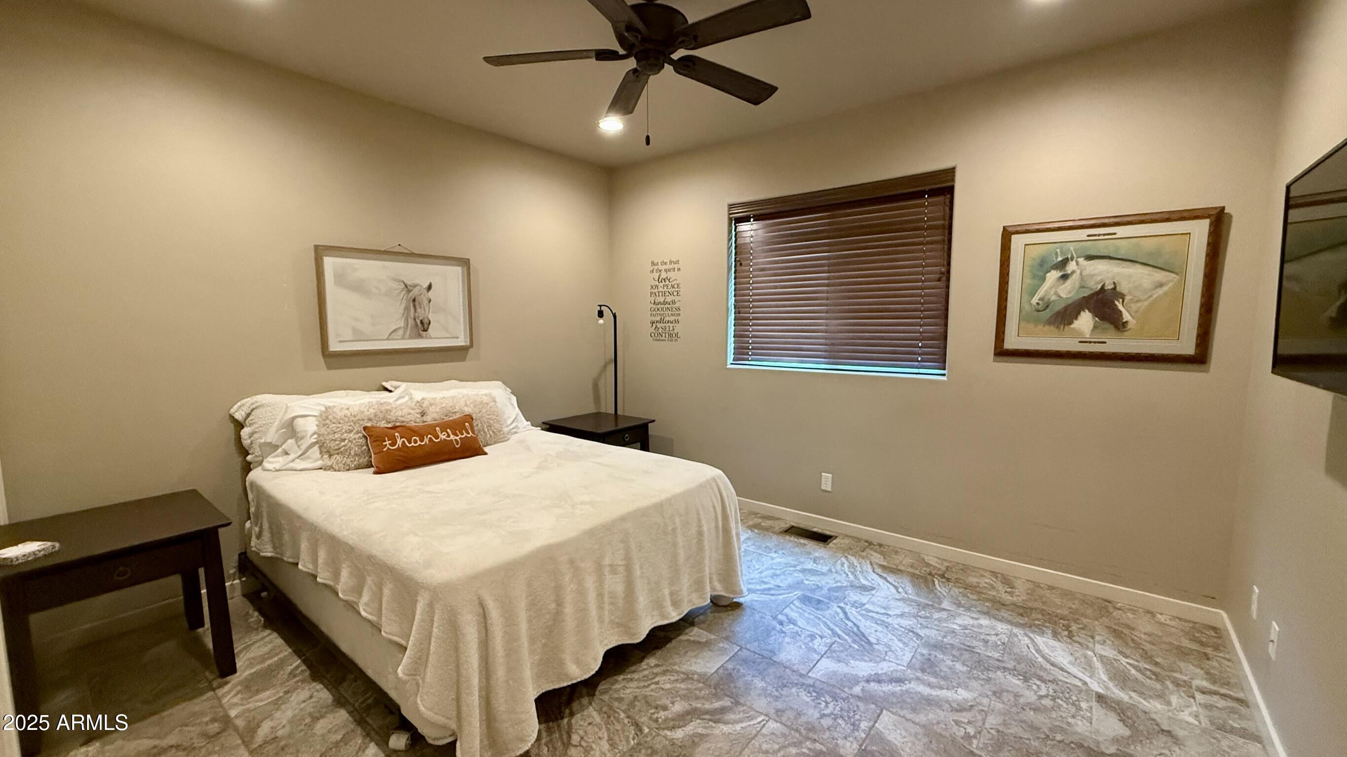 913 South Coronado Way Payson, AZ 85541 - Photo 33 of 52 a bedroom with a bed and painting on the wall