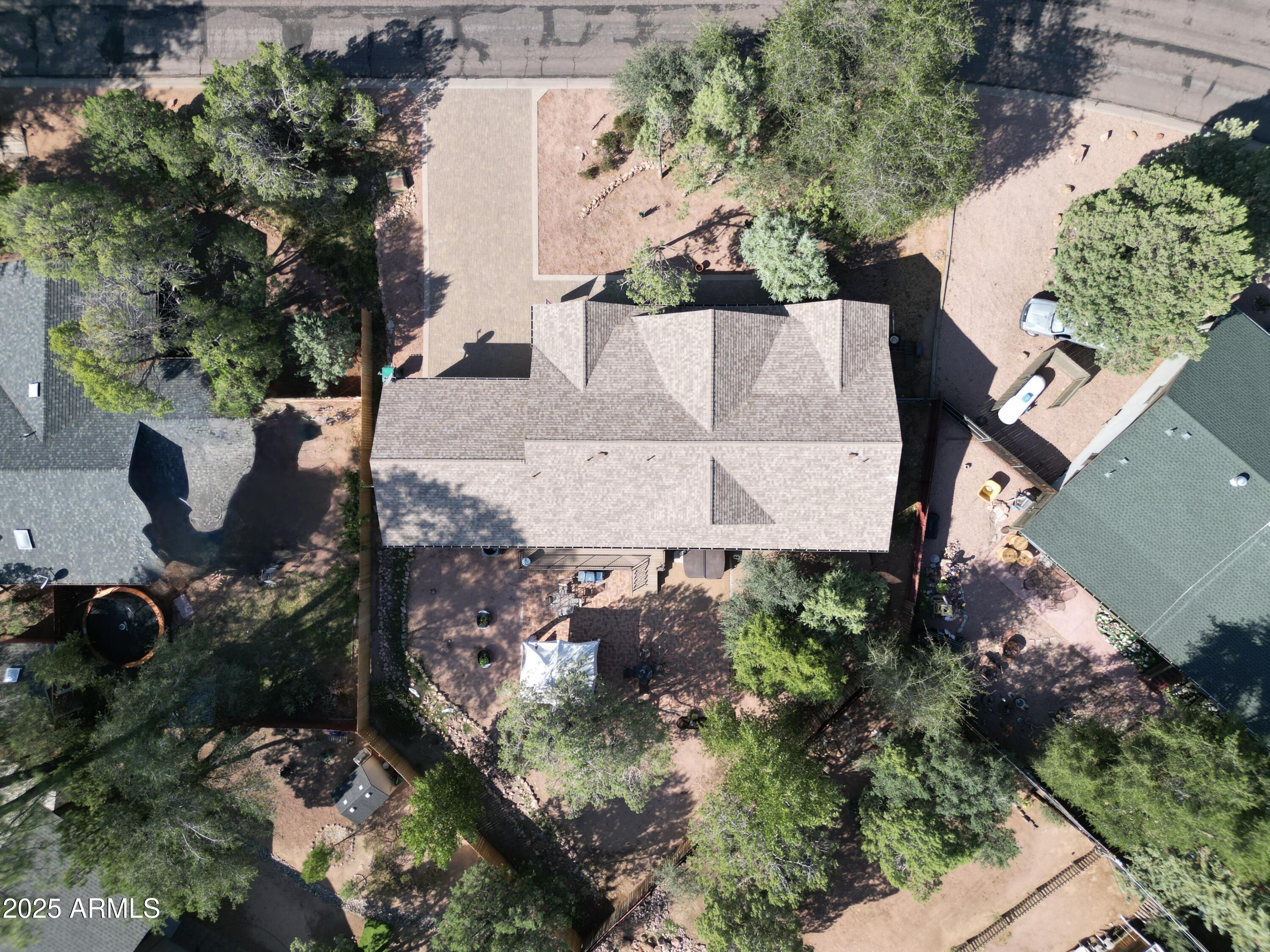 913 South Coronado Way Payson, AZ 85541 - Photo 51 of 52 an aerial view of a house with a yard and black water fountain