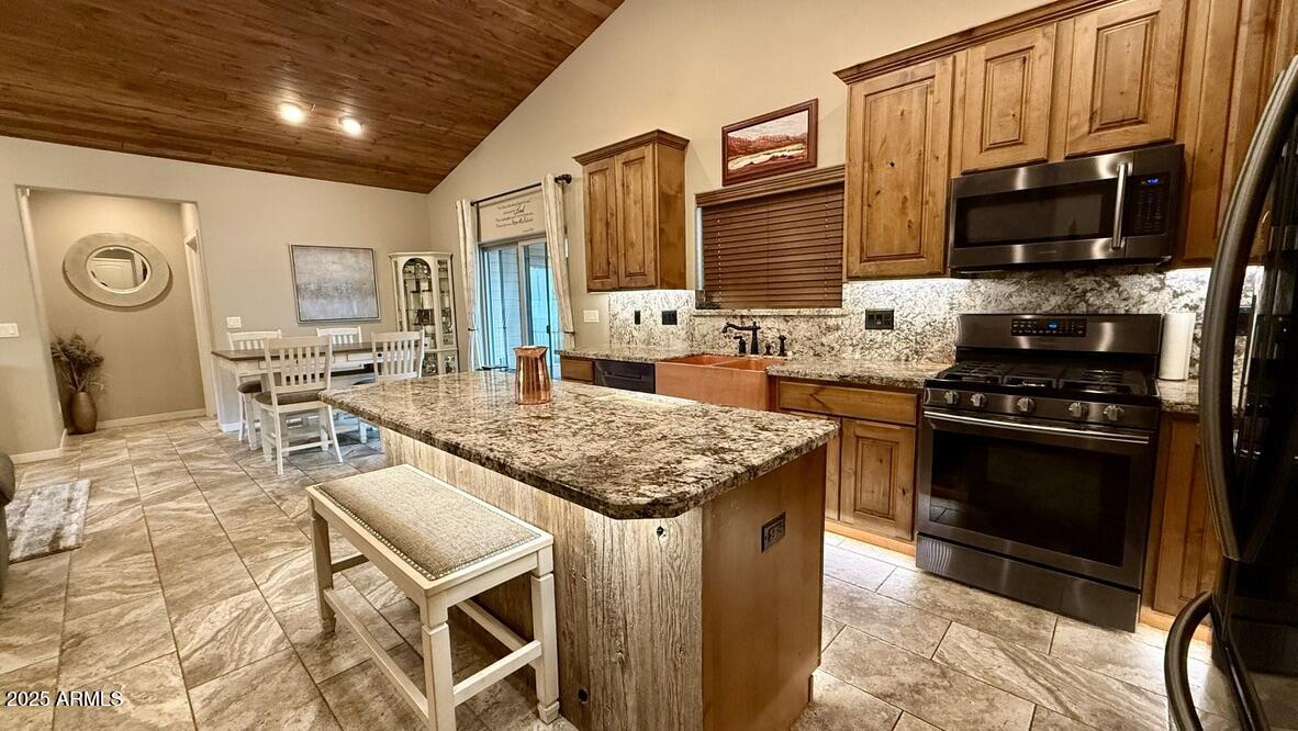913 South Coronado Way Payson, AZ 85541 - Photo 6 of 52 a kitchen with stainless steel appliances granite countertop a stove sink and cabinets