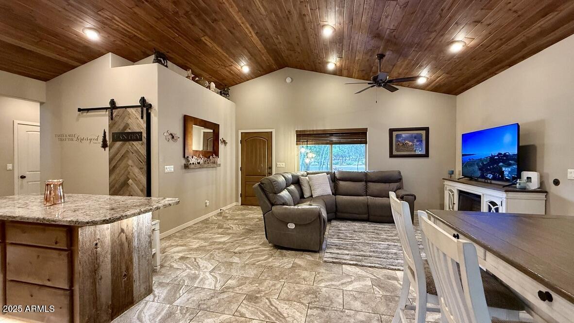 913 South Coronado Way Payson, AZ 85541 - Photo 9 of 52 a living room with furniture and a flat screen tv