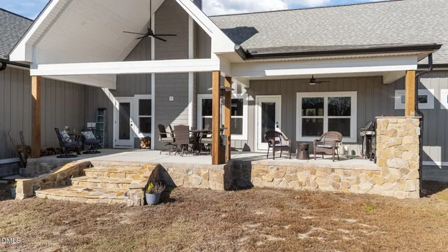 an aerial view of a house with swimming pool