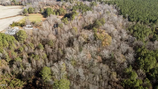 a bedroom with furniture and a tv