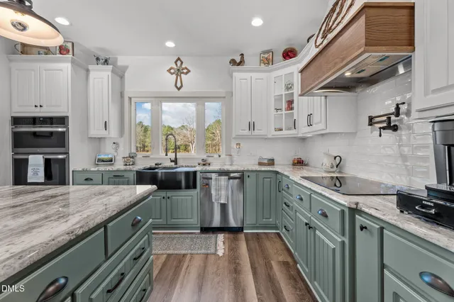 a bedroom with a bed and a flat tv screen on dresser