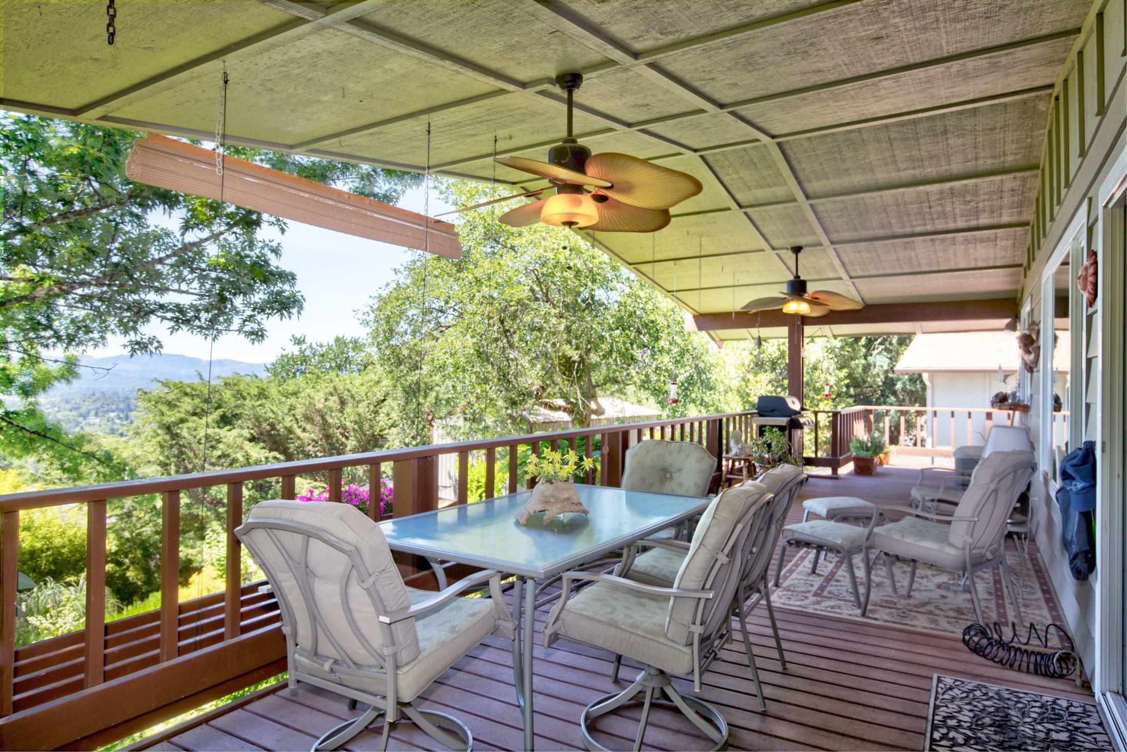 700 Trollview Road Grants Pass, OR 97527 - Photo 7 of 30 774 sq ft of covered deck looking out over the panoramic view.