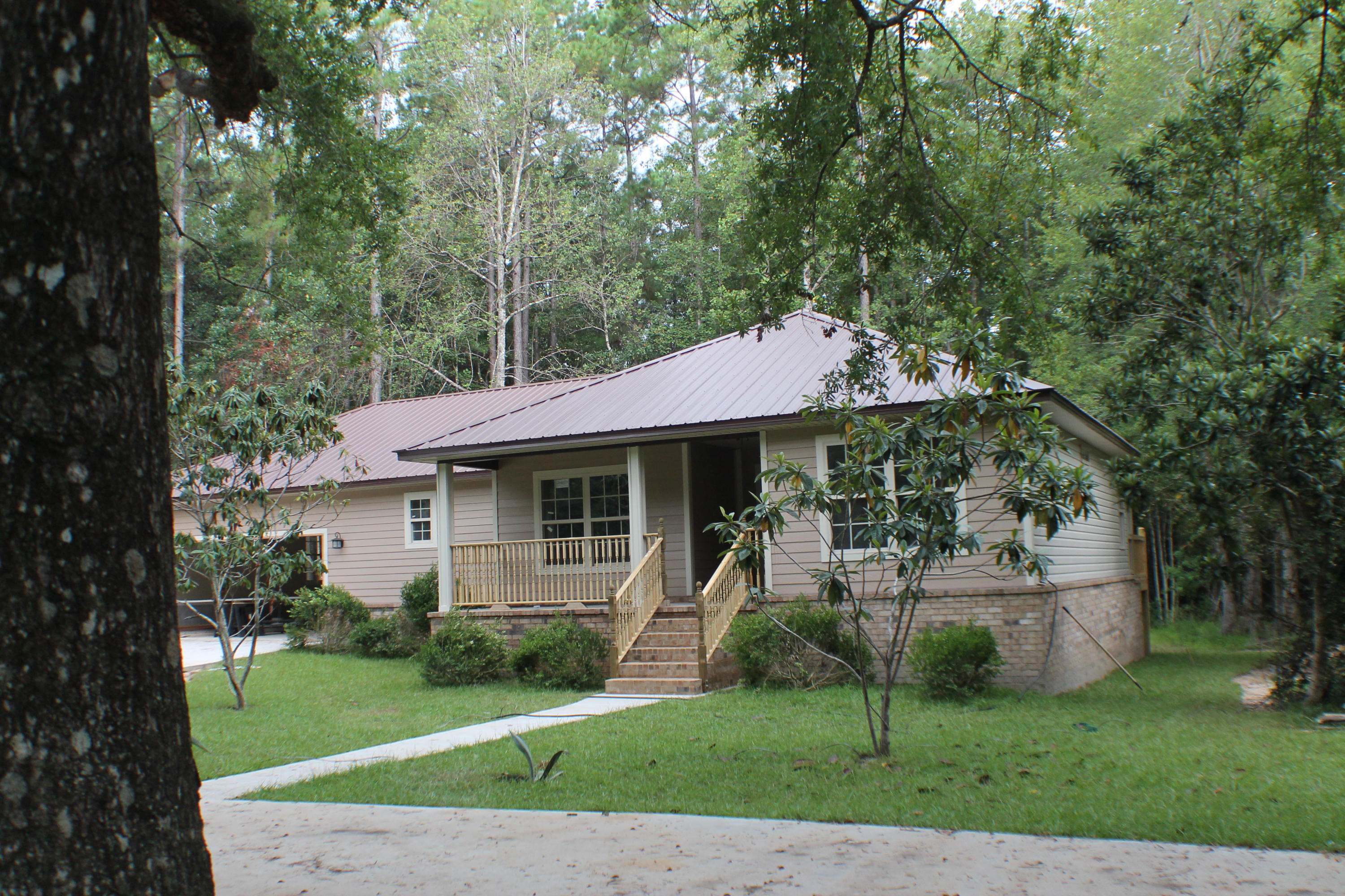 5588 Old Bethel Road Crestview, FL 32536 - Photo 3 of 42 a view of a house with a yard