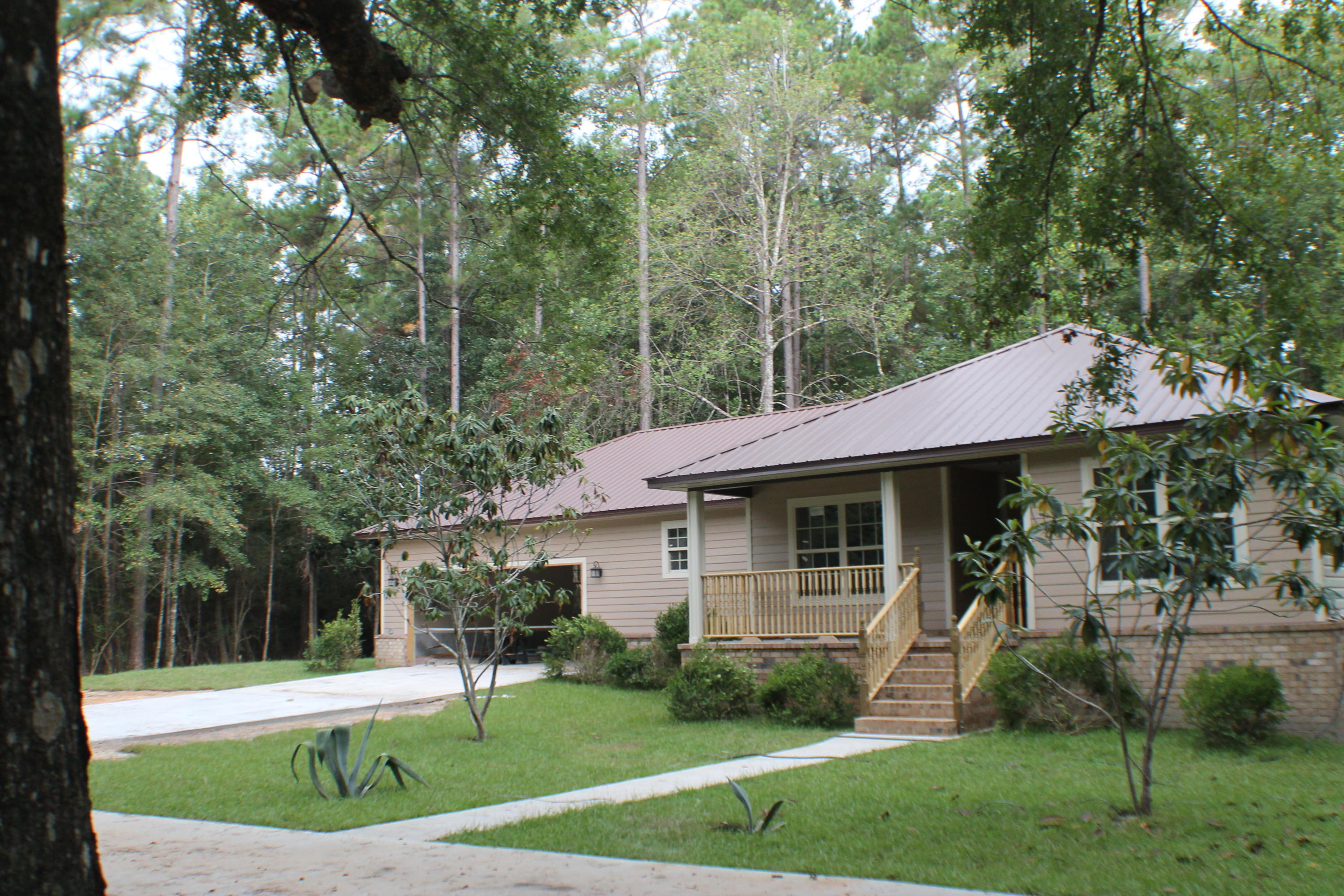 5588 Old Bethel Road Crestview, FL 32536 - Photo 4 of 42 a view of a house with a yard