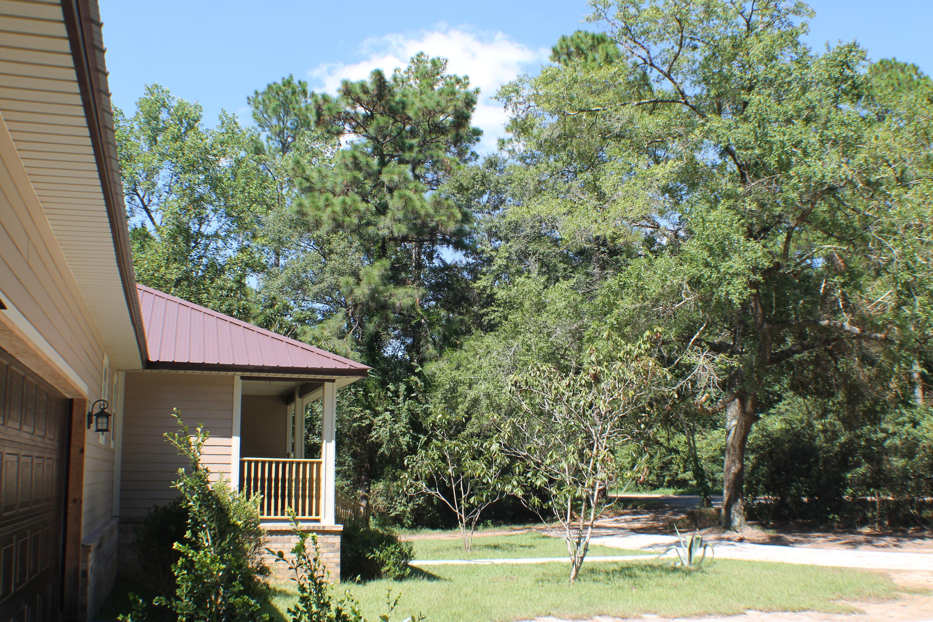 5588 Old Bethel Road Crestview, FL 32536 - Photo 8 of 42 a view of a house with a yard