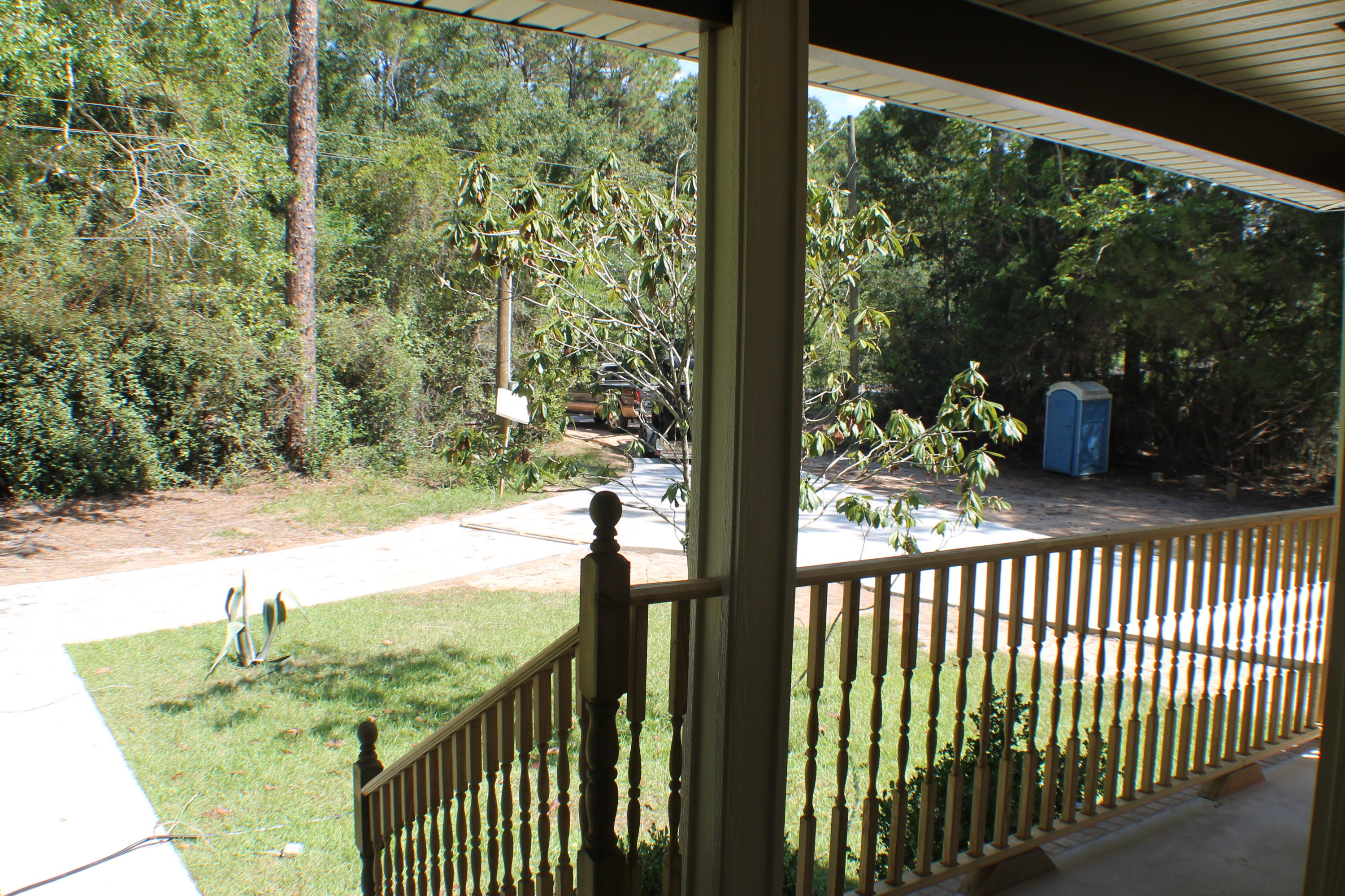 5588 Old Bethel Road Crestview, FL 32536 - Photo 9 of 42 a view of a porch with a yard