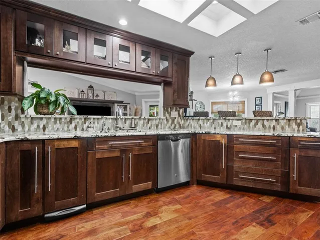 a kitchen with a refrigerator and cabinets
