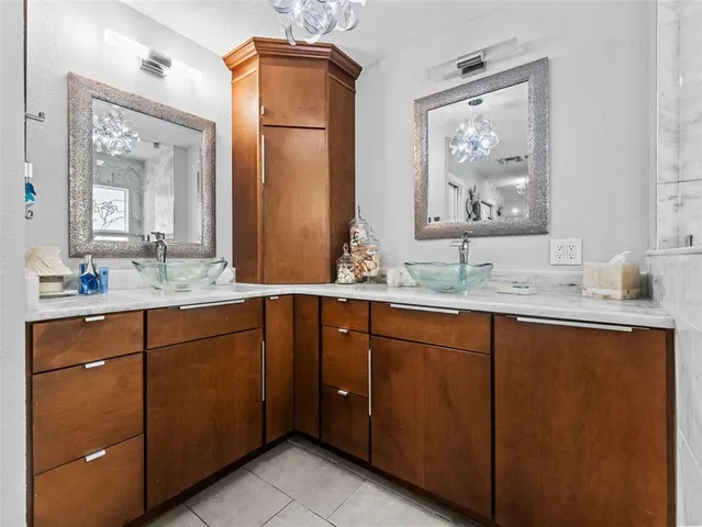 a bathroom with a sink a toilet and a shower