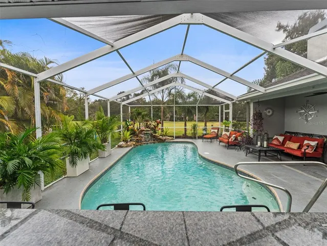 a view of a swimming pool with a patio