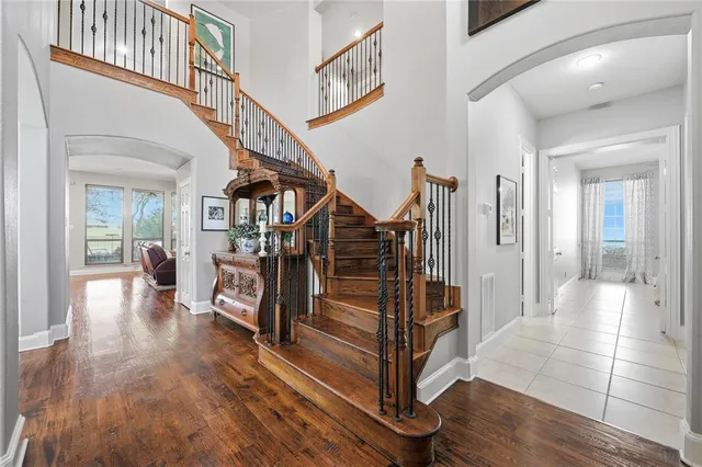 a view of entryway and hall with wooden floor