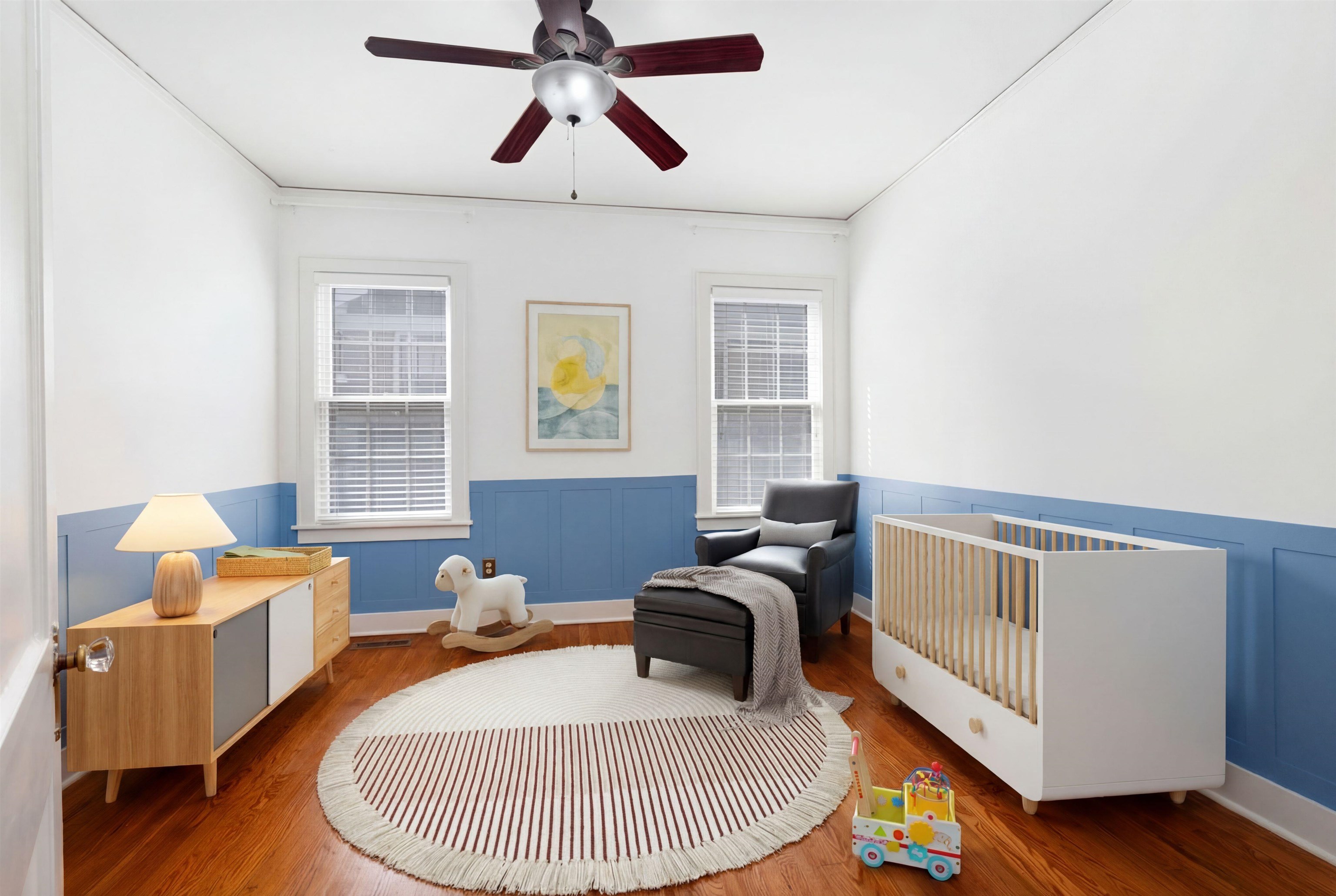 331 Alexander Street Memphis, TN 38111 - Photo 20 of 25 Living area with wood finished floors, a wainscoted wall, and a ceiling fan