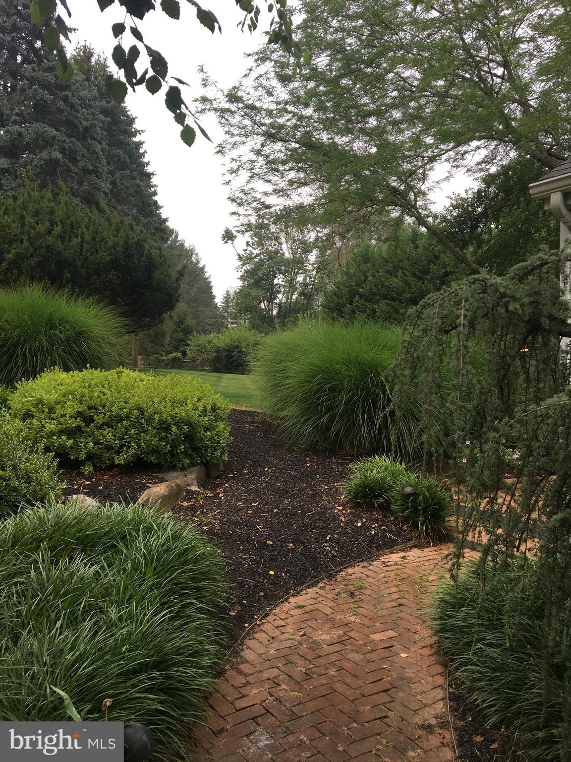 313 Sentry Lane Wayne, PA 19087 - Photo 31 of 34 Brick walkway to back yard