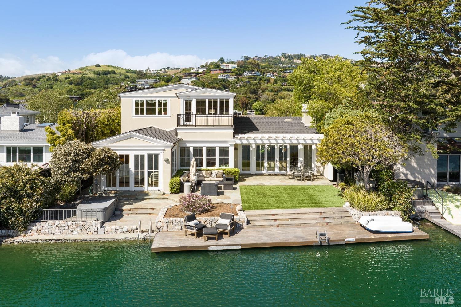 a front view of a house with a yard table and chairs