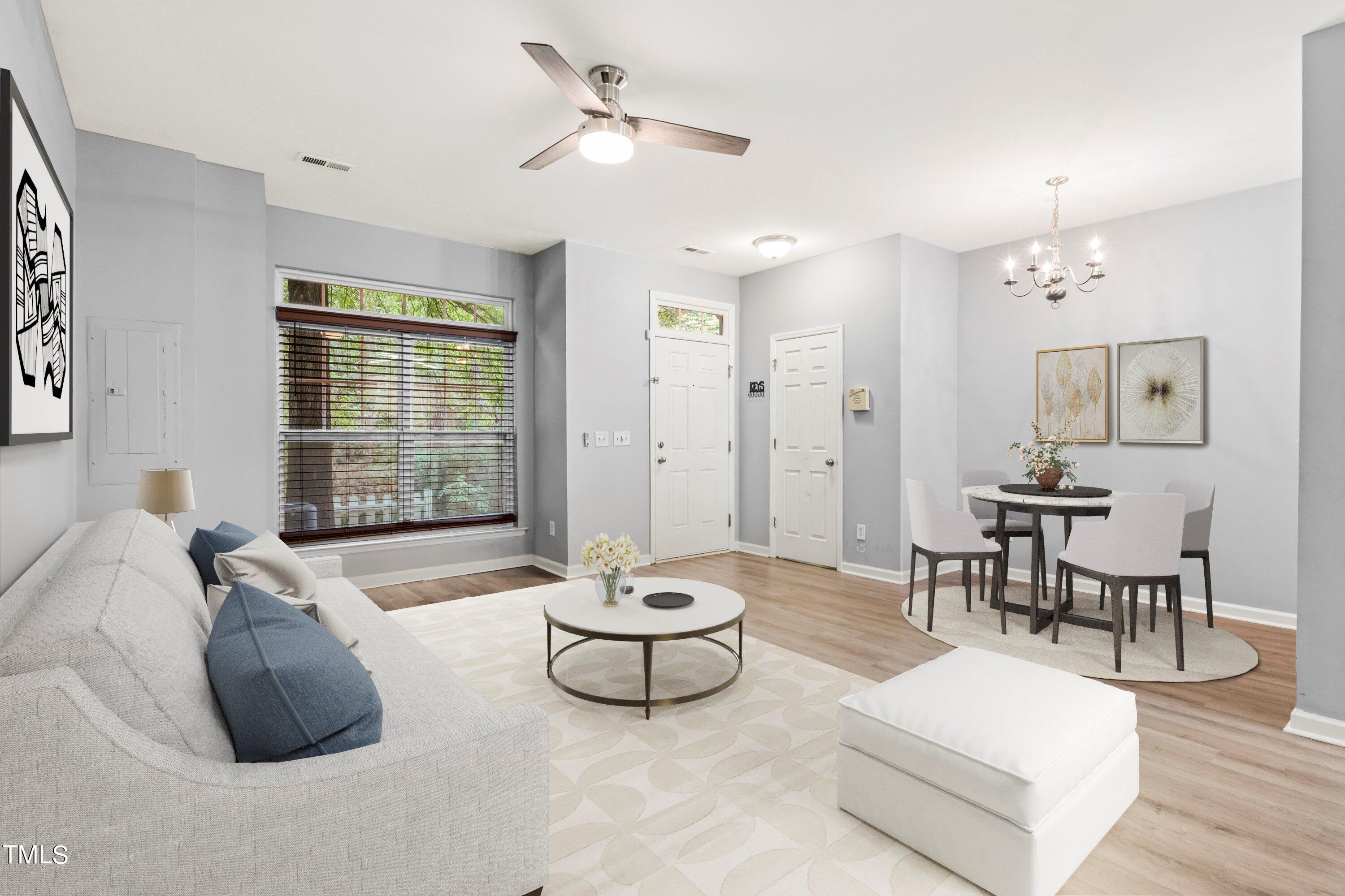 350 Gilman Lane, Unit 108 Raleigh, NC 27610 - Photo 1 of 34 a living room with furniture and a window