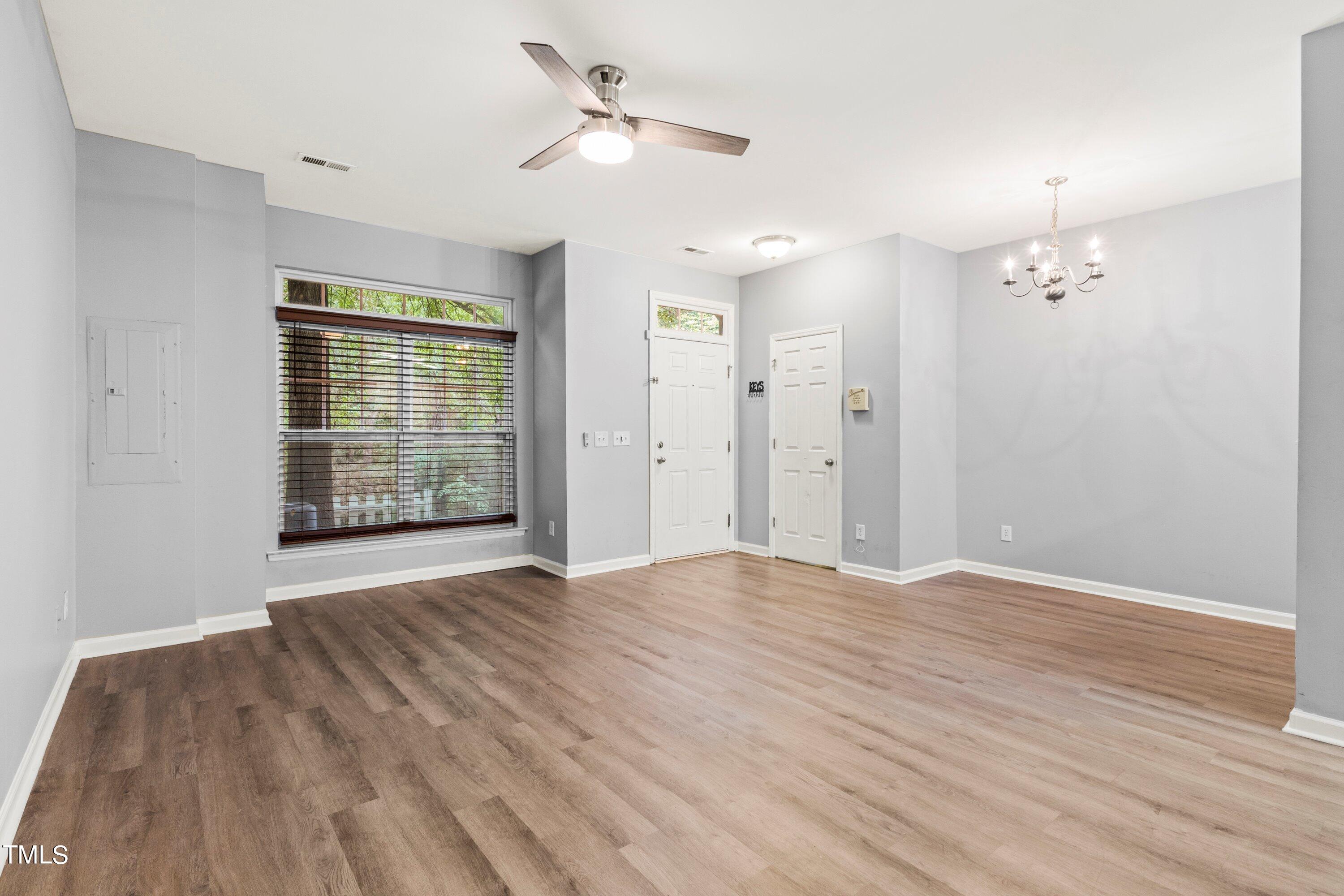 350 Gilman Lane, Unit 108 Raleigh, NC 27610 - Photo 12 of 34 wooden floor in an empty room with a window