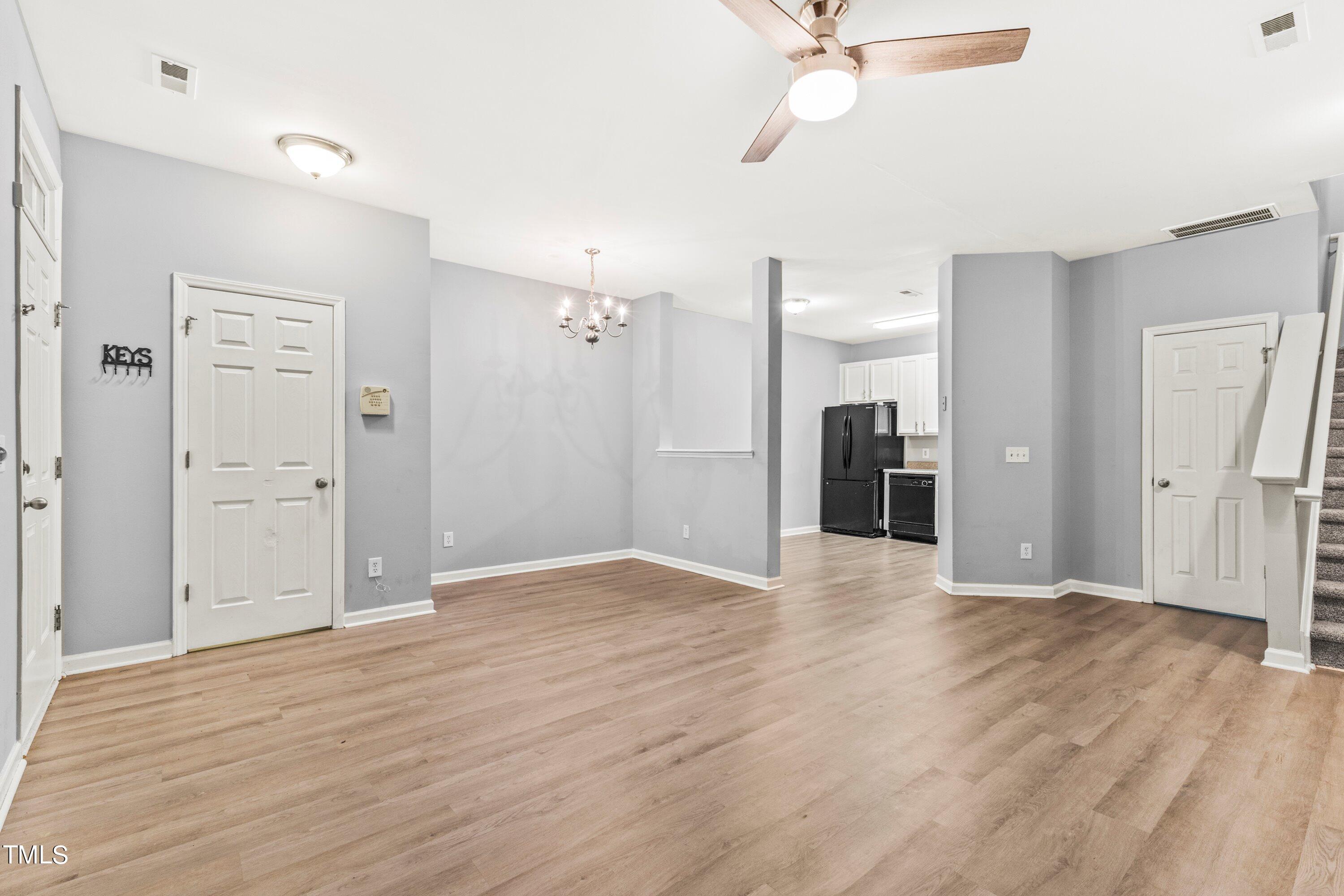 350 Gilman Lane, Unit 108 Raleigh, NC 27610 - Photo 13 of 34 a view of an empty room with wooden floor