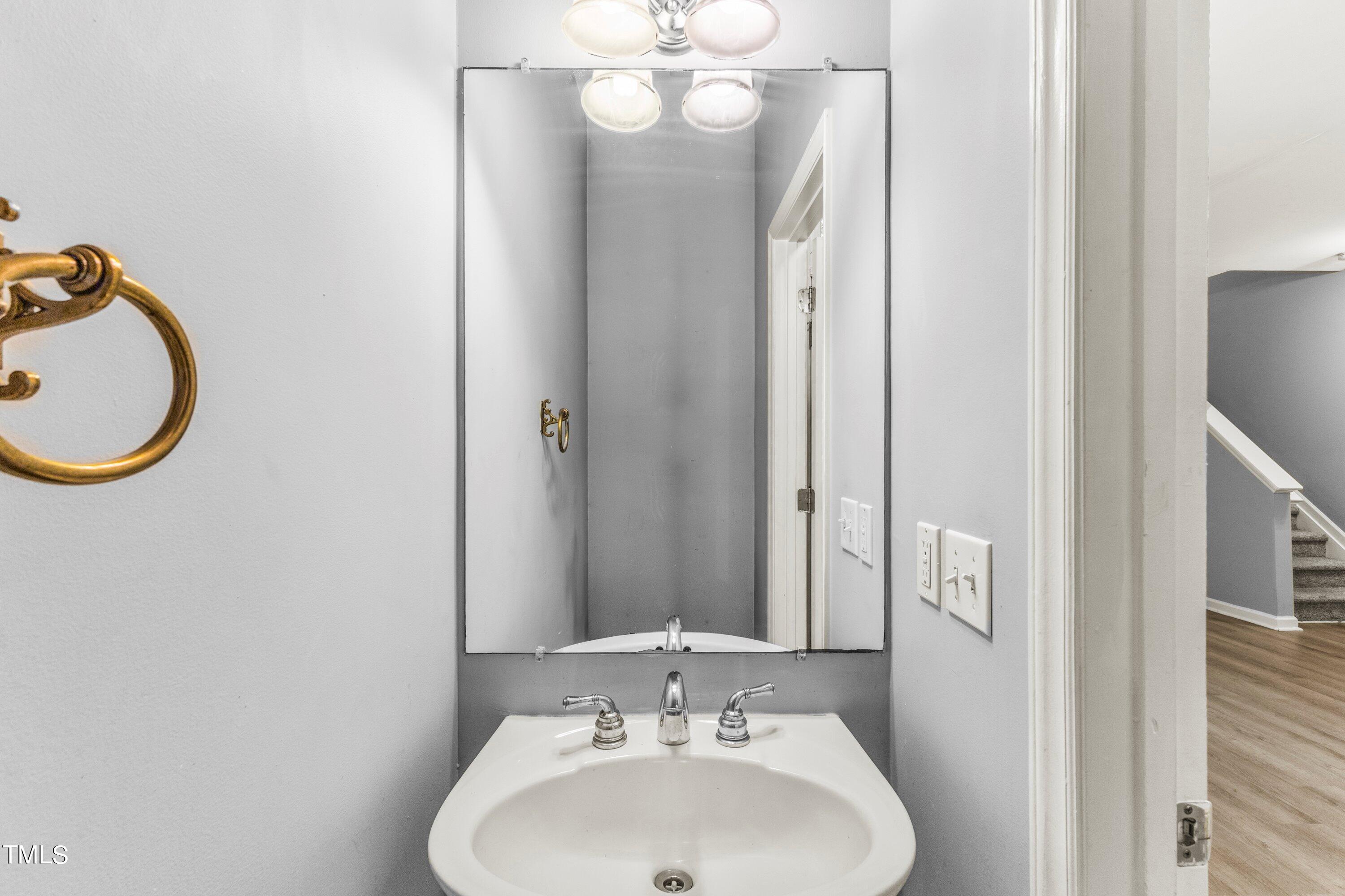 350 Gilman Lane, Unit 108 Raleigh, NC 27610 - Photo 14 of 34 a bathroom with a sink and a mirror