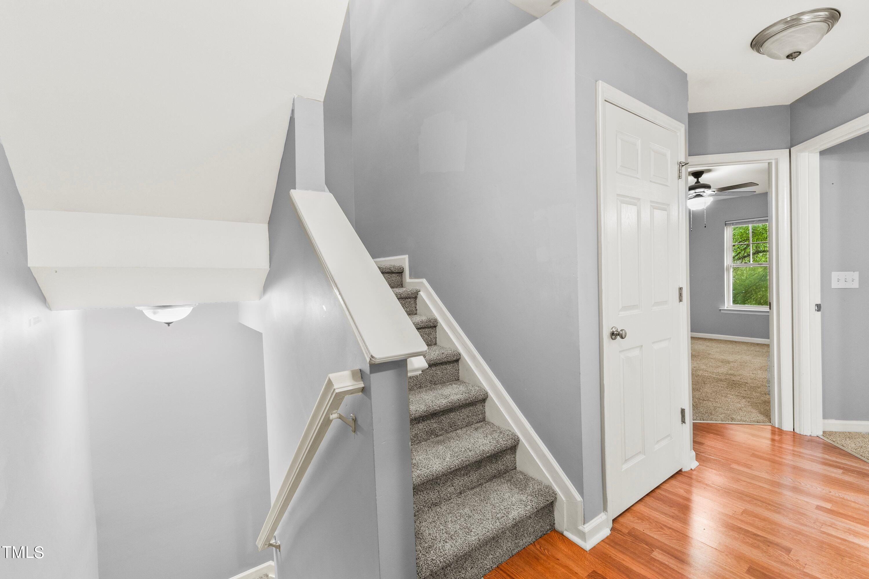 350 Gilman Lane, Unit 108 Raleigh, NC 27610 - Photo 16 of 34 a view of entryway and hall with wooden floor